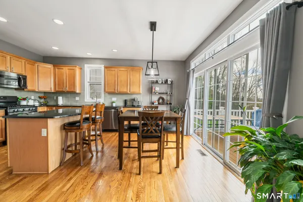 a view of a dining room with furniture window and outside view