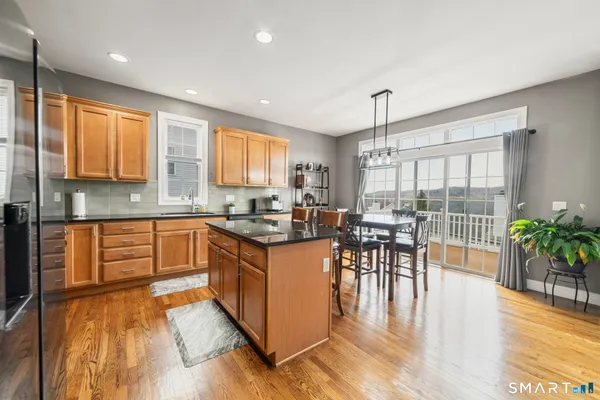 a kitchen with lots of counter top space and dining table