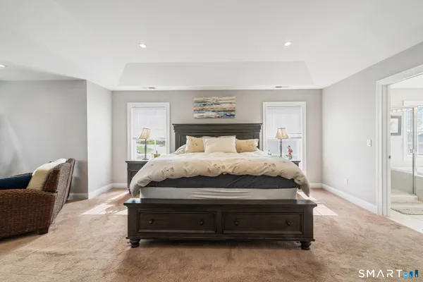 a bedroom with a bed and a couch