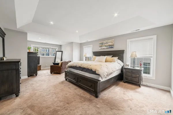 a bedroom with a bed and furniture