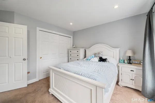 a bedroom with a bed and a cabinets
