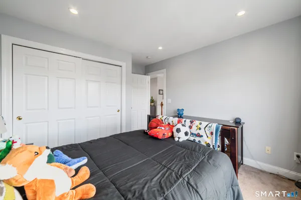 a bedroom with bed and window