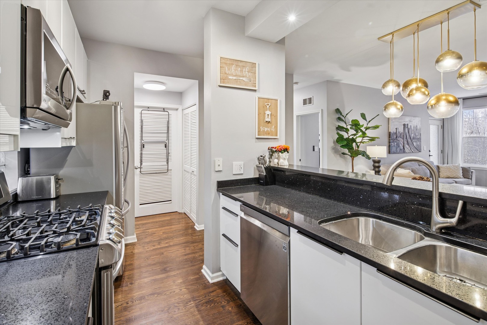 301 West Scott Street, Unit 103 Chicago, IL 60610 - Photo 8 of 17 a kitchen with a sink and a stove top oven