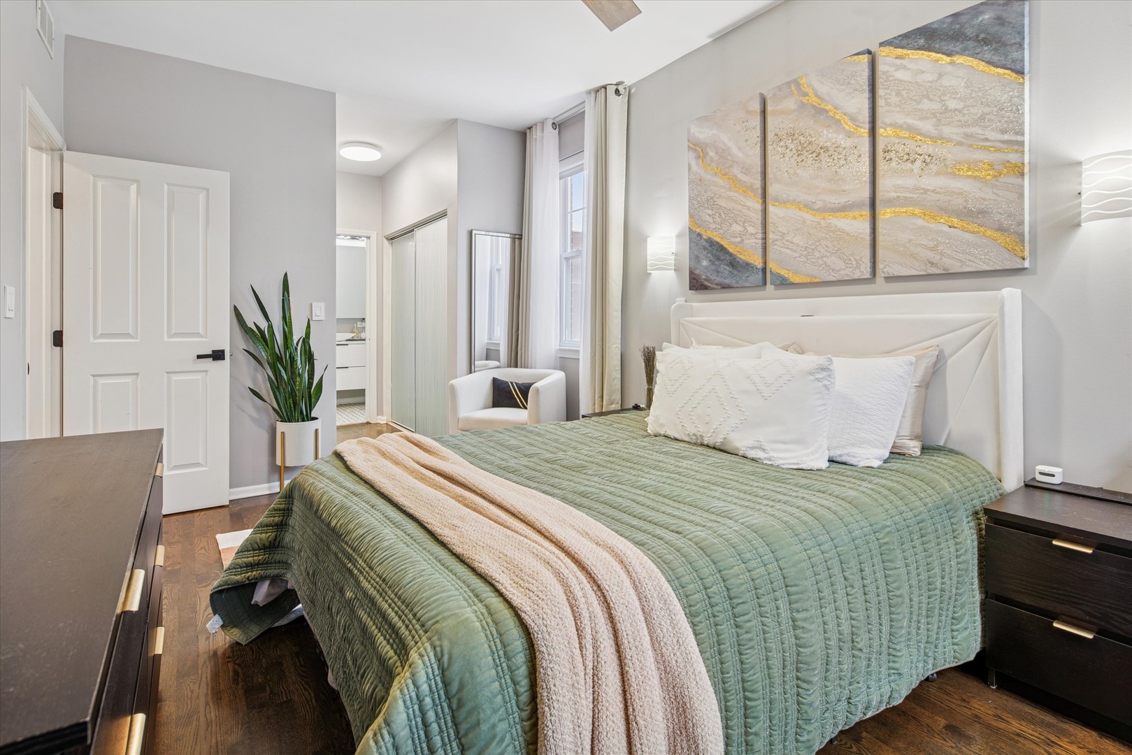 301 West Scott Street, Unit 103 Chicago, IL 60610 - Photo 10 of 17 a bedroom with a bed and a window