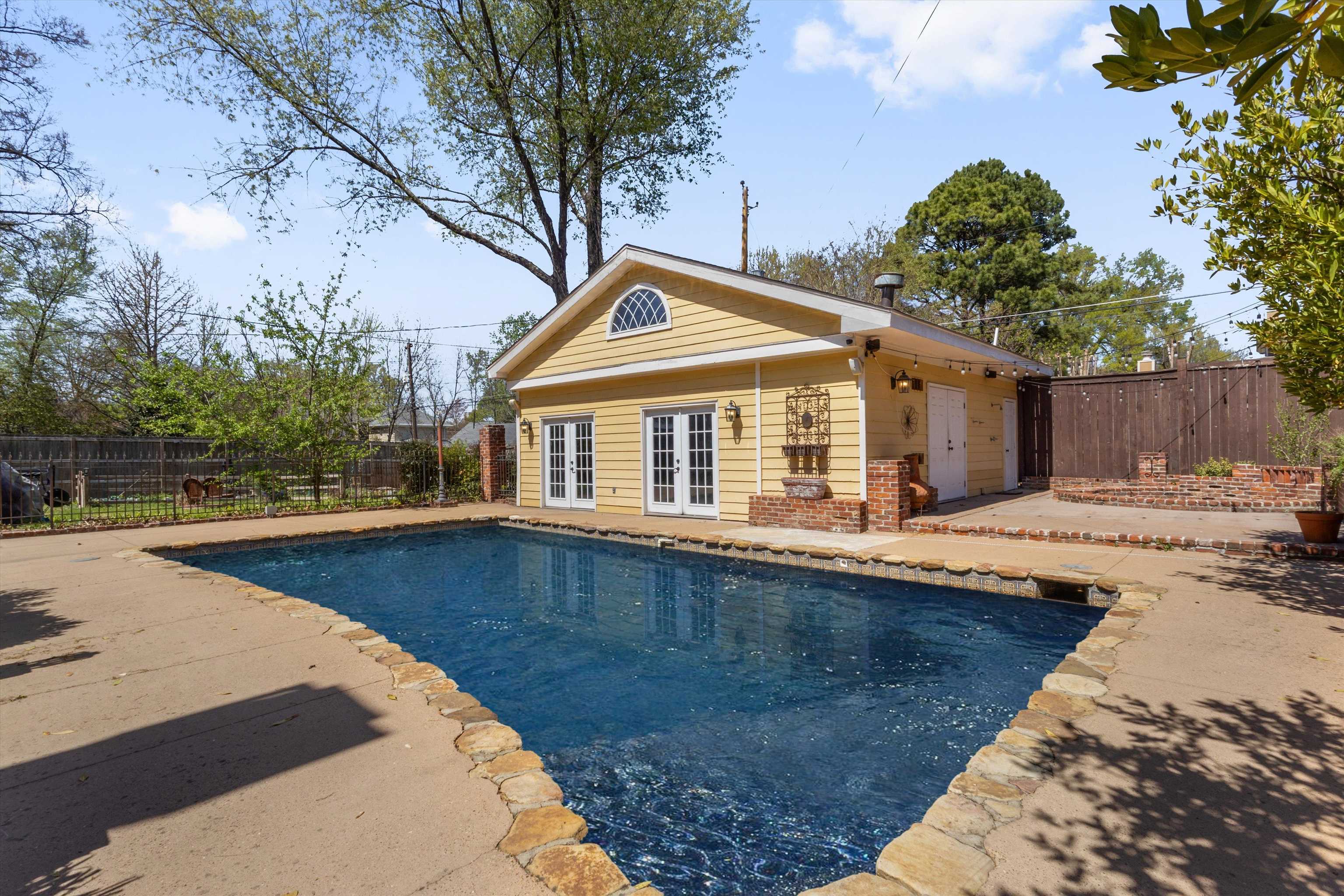 1680 Carruthers Place Memphis, TN 38112 - Photo 27 of 39 a front view of a house with swimming pool