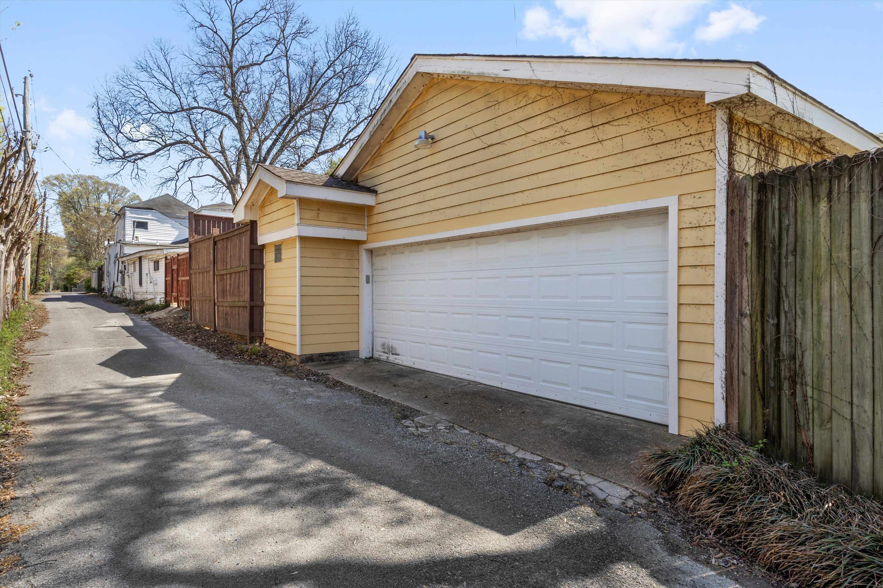 1680 Carruthers Place Memphis, TN 38112 - Photo 37 of 39 a view of a house with a yard and garage