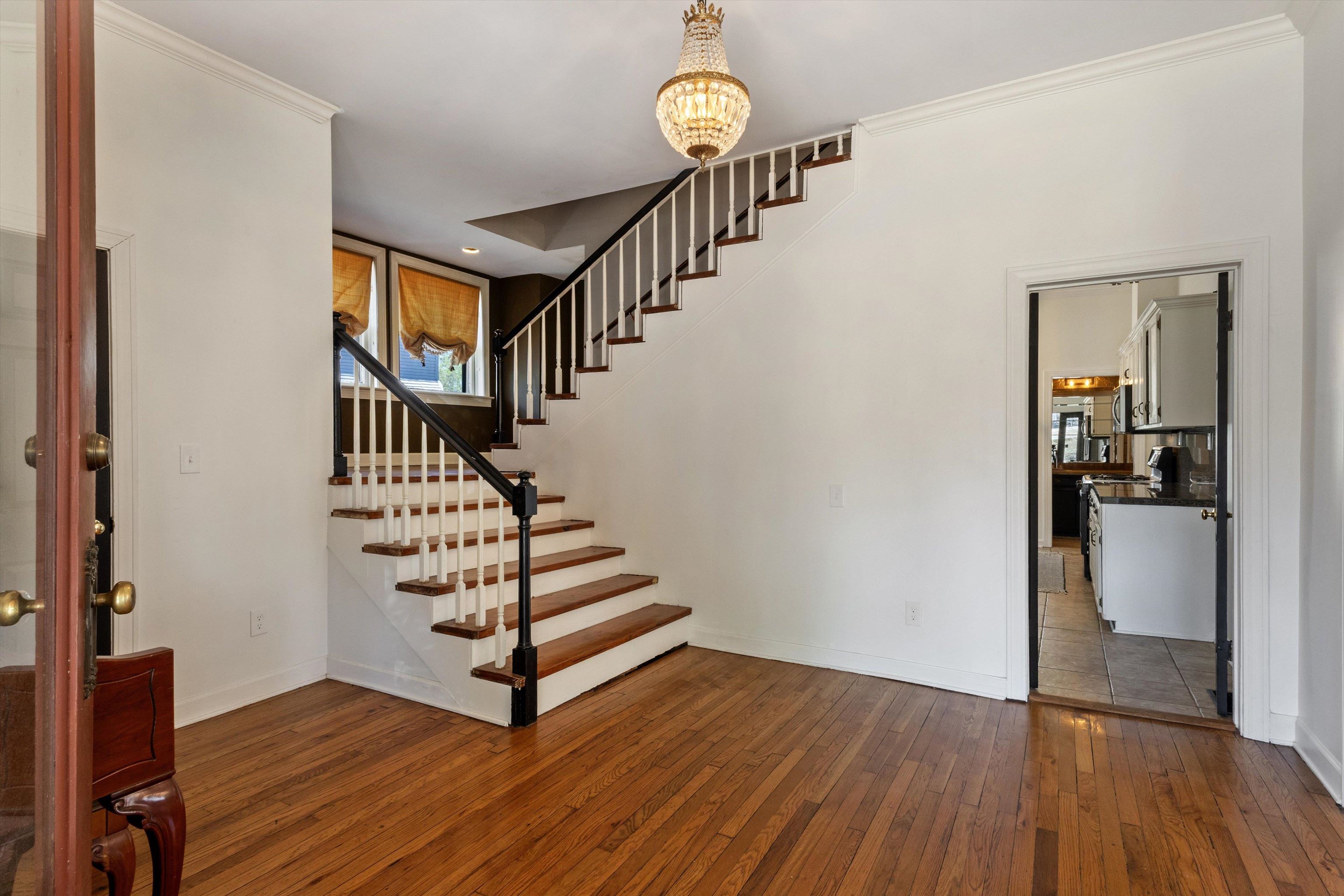 1680 Carruthers Place Memphis, TN 38112 - Photo 6 of 39 a view of entryway and hall with wooden floor