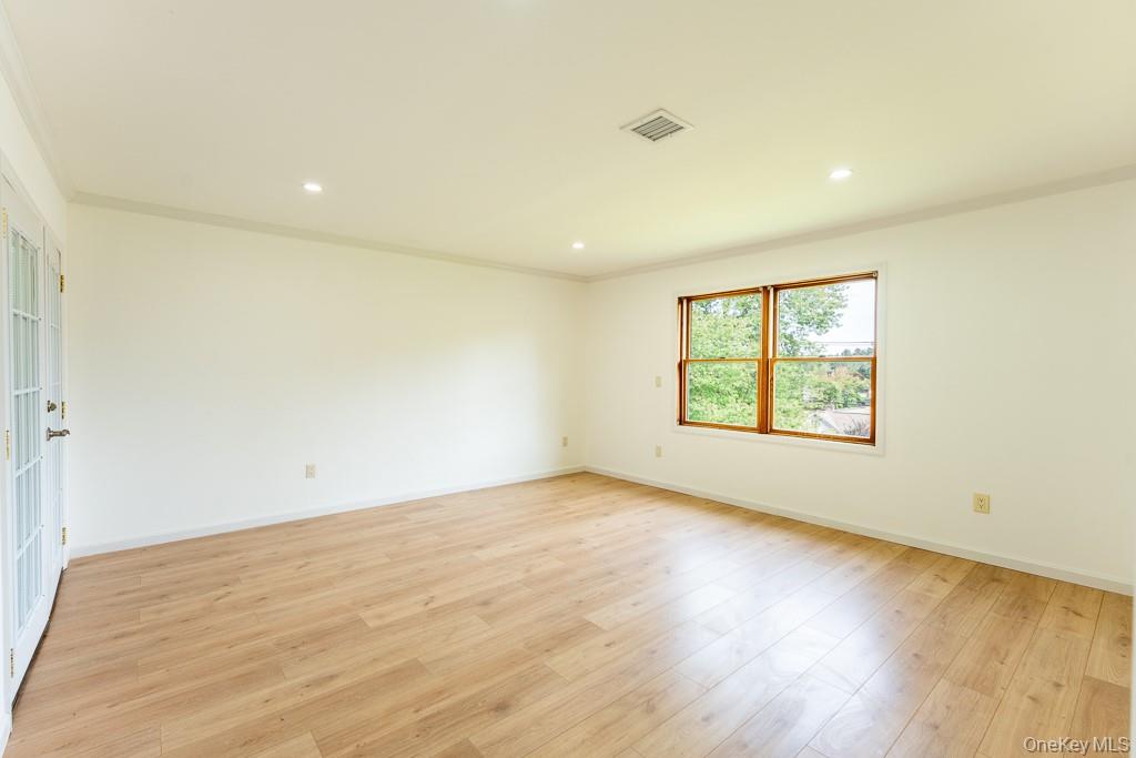 202 2nd Road Wappingers Falls, NY 12590 - Photo 14 of 24 Spare room featuring crown molding, light wood-style flooring, and recessed lighting