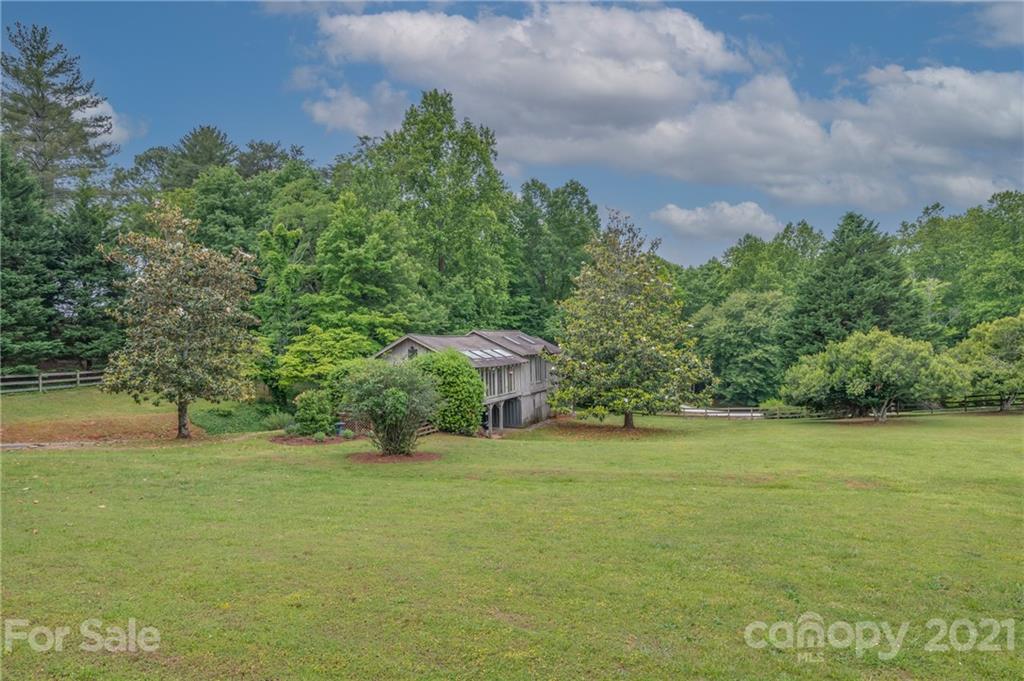 133 Ridgetop Road, Unit 16 Tryon, NC 28782 - Photo 22 of 23 a front view of a house with a yard