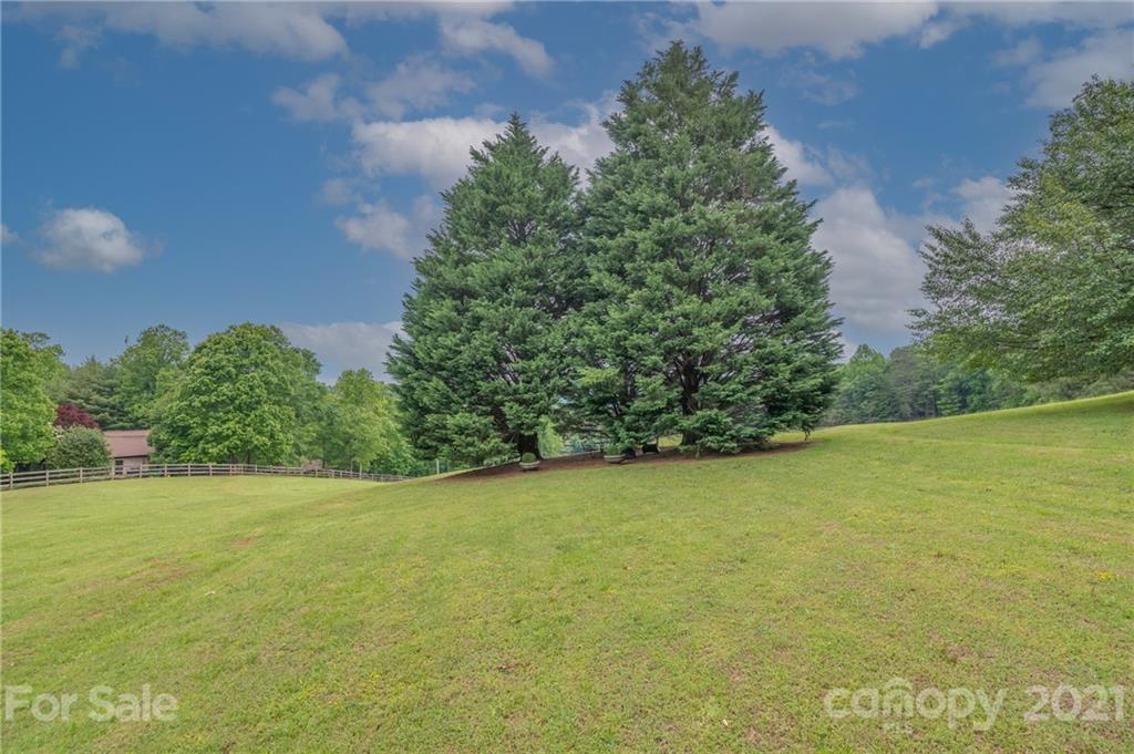 133 Ridgetop Road, Unit 16 Tryon, NC 28782 - Photo 23 of 23 a view of a field with an outdoor space