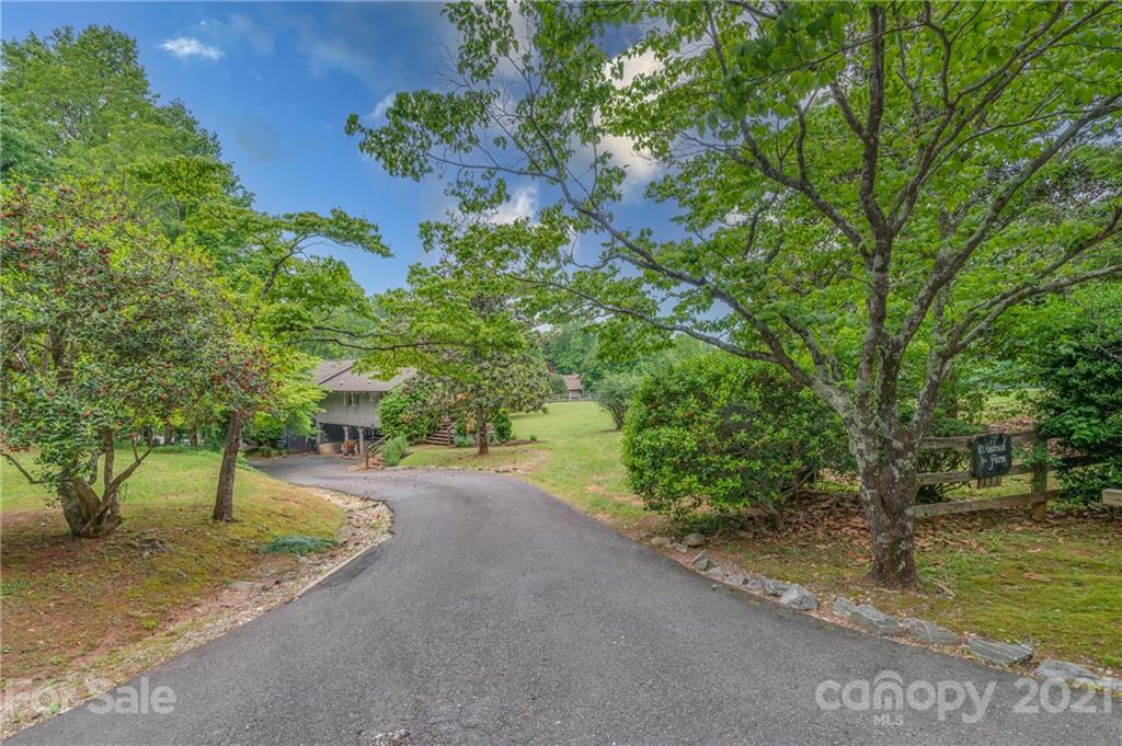 133 Ridgetop Road, Unit 16 Tryon, NC 28782 - Photo 4 of 23 a view of a road with a yard