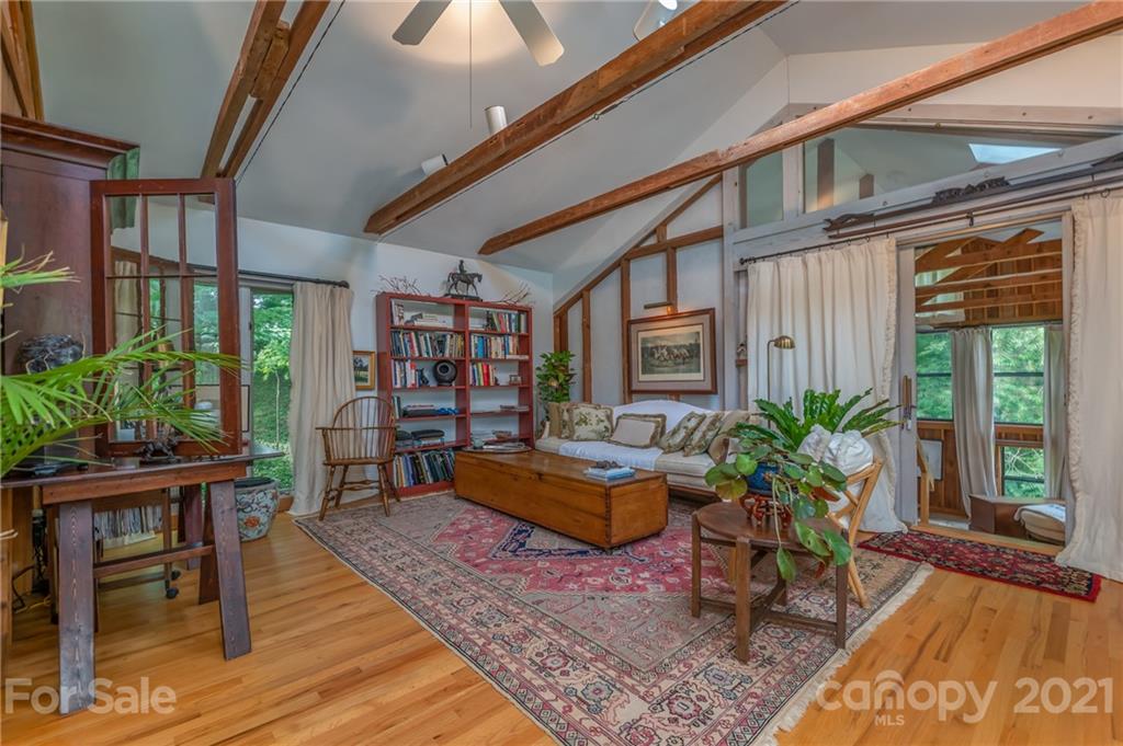133 Ridgetop Road, Unit 16 Tryon, NC 28782 - Photo 5 of 23 a dining room with furniture and wooden floor