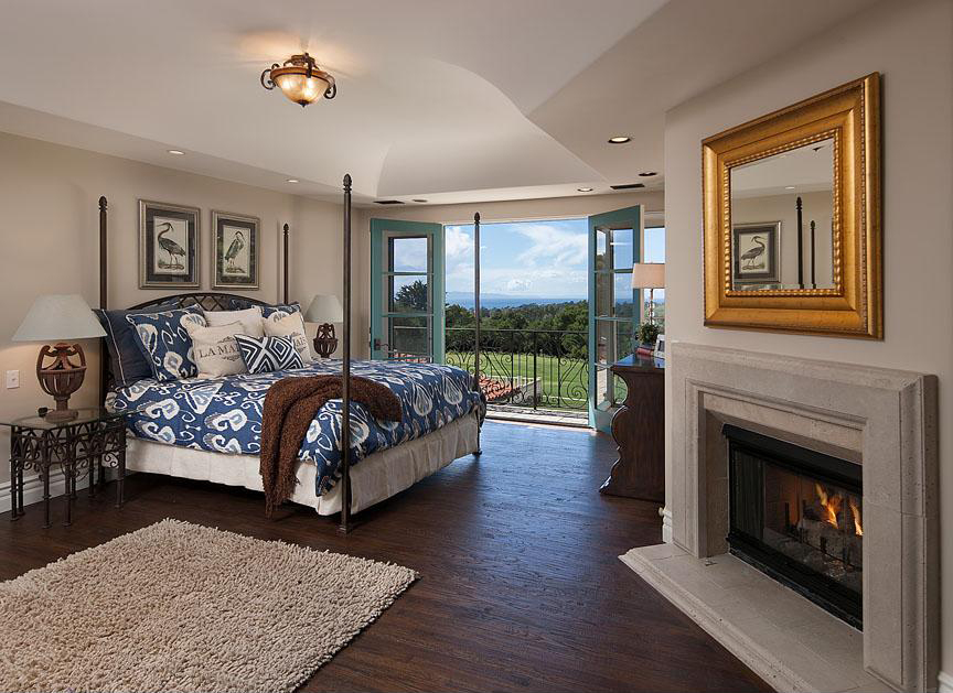 1565 Las Tunas Road Montecito, CA 93108 - Photo 6 of 11 a bedroom with a bed and a fireplace