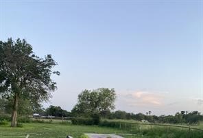 206 Scott Street Alice, TX 78332 - Photo 1 of 3 a view of a big yard with a house in the background