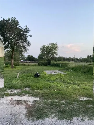 a view of a lake with a big yard