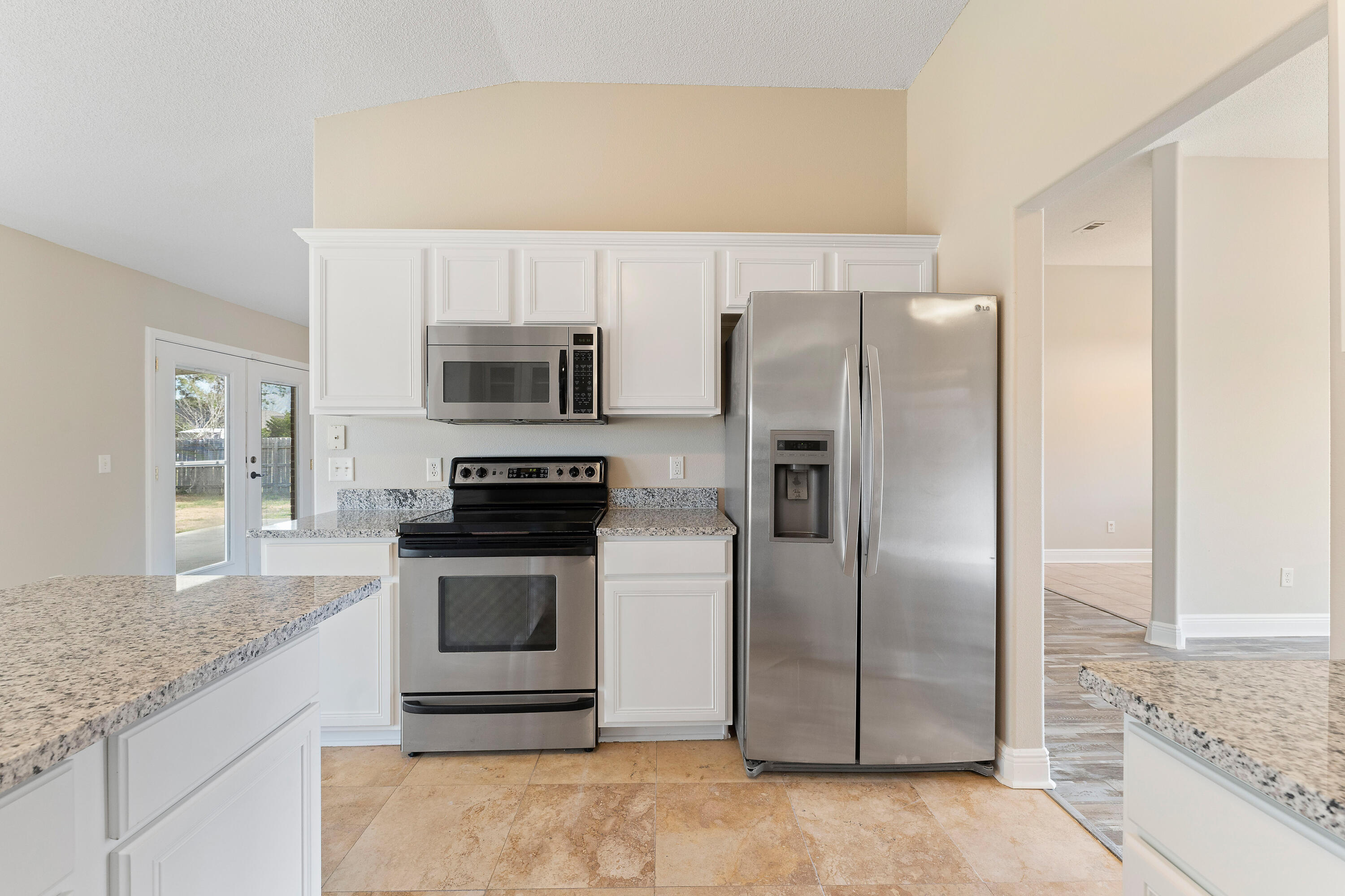 7162 Riverview Road Navarre, FL 32566 - Photo 26 of 33 a kitchen with a refrigerator sink and microwave