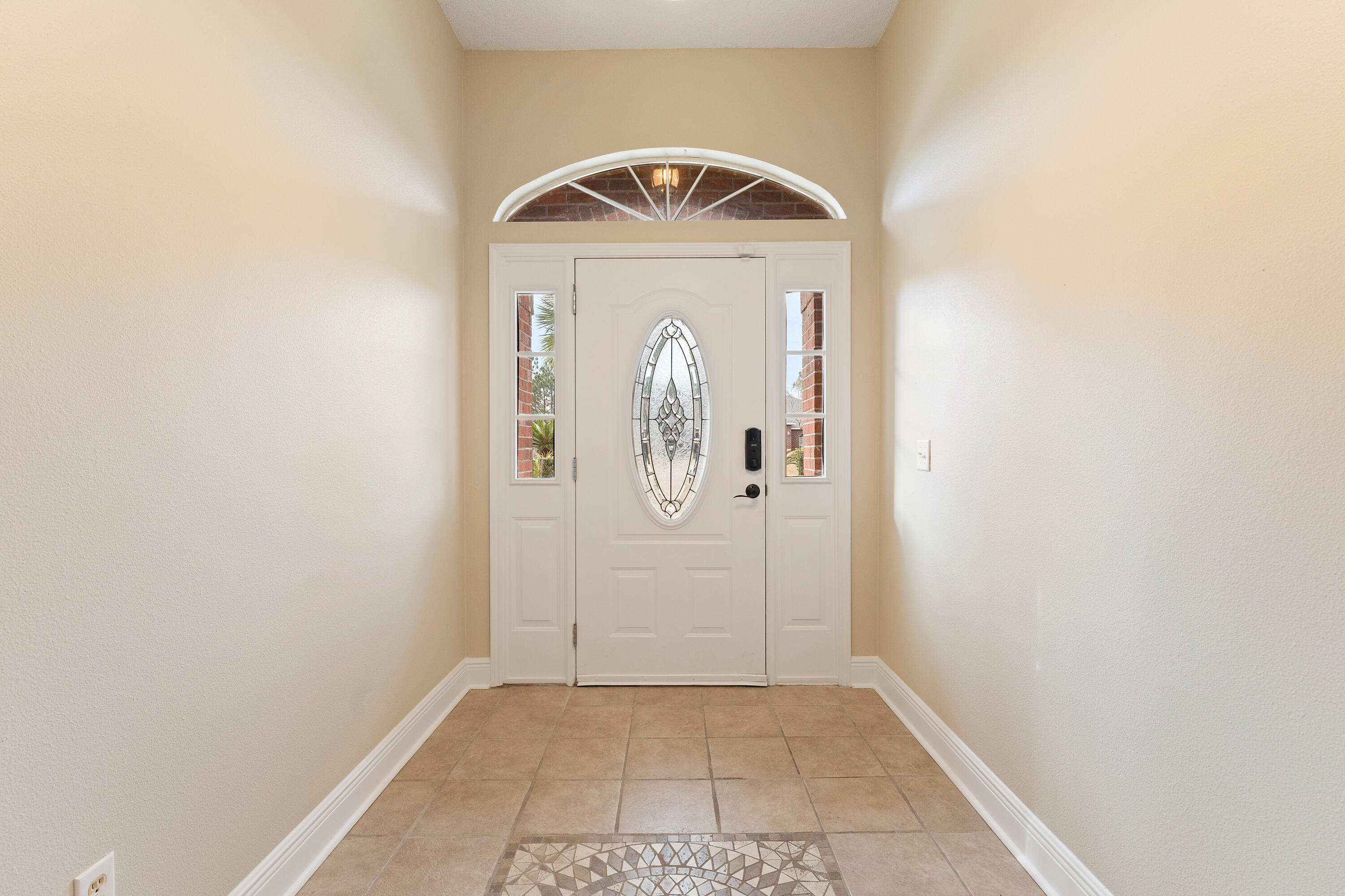 7162 Riverview Road Navarre, FL 32566 - Photo 5 of 33 a view of entryway with wooden floor