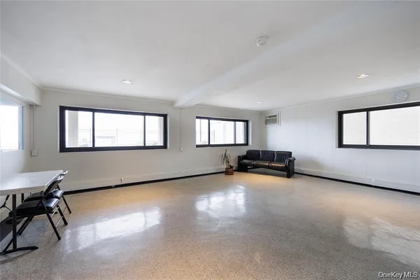 a view of a livingroom with furniture and window