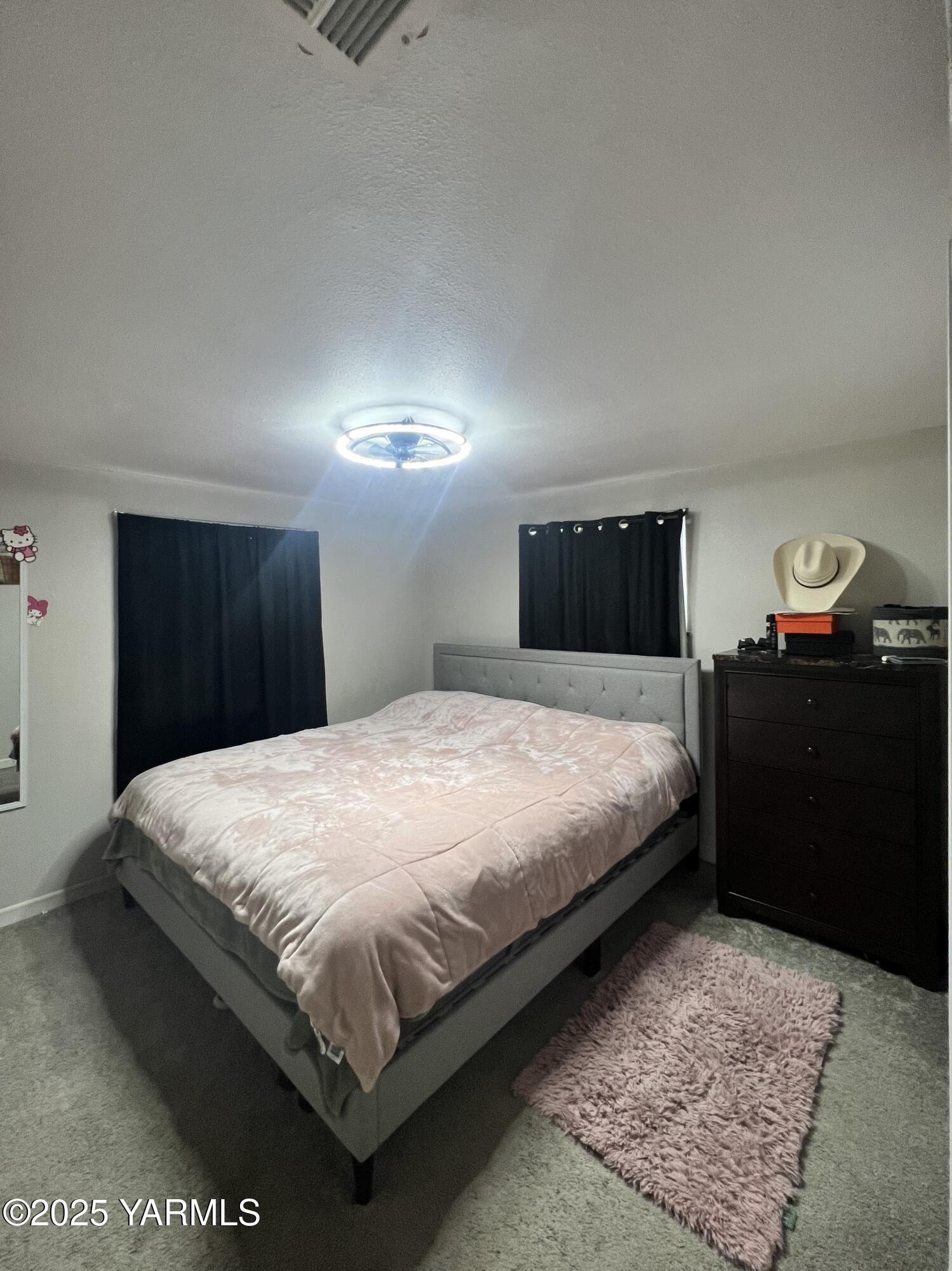 3609 South 3rd Street Union Gap, WA 98903 - Photo 5 of 14 a bedroom with a bed and a dresser