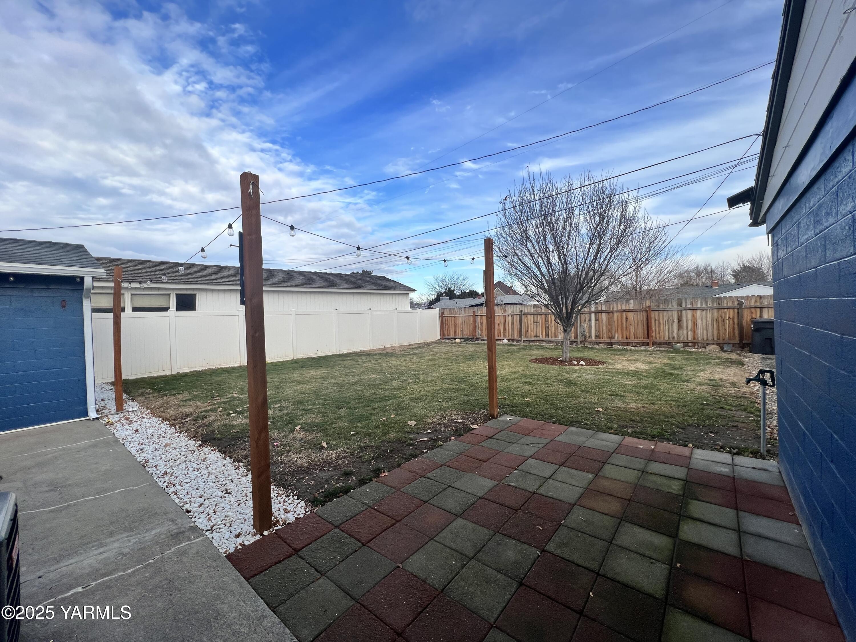 3609 South 3rd Street Union Gap, WA 98903 - Photo 8 of 14 a view of a house with a backyard