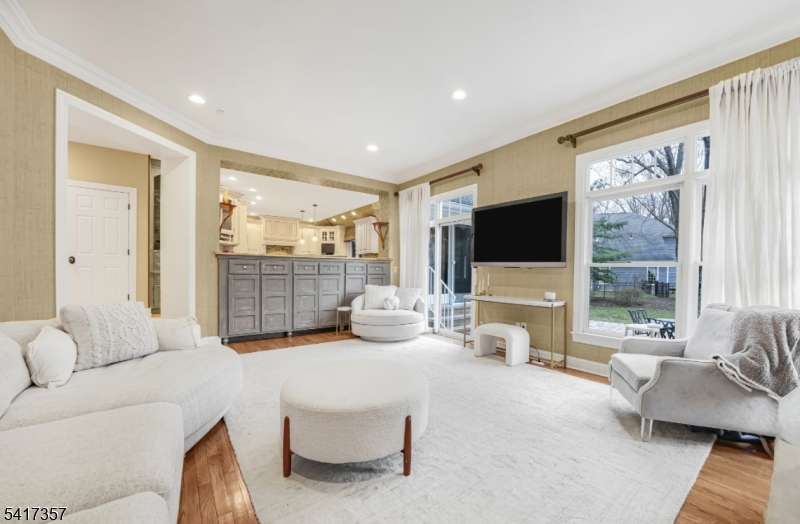 47 Abbott Road Montville, NJ 07082 - Photo 12 of 32 a living room with furniture tv and a large window