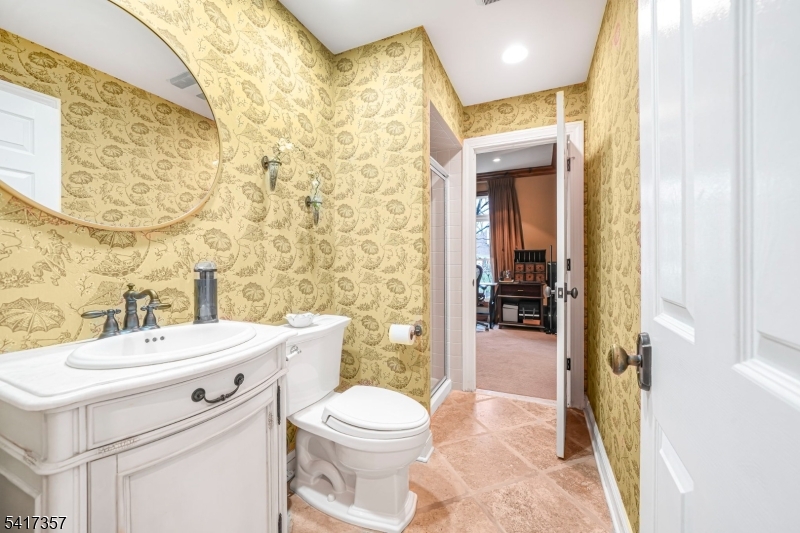 47 Abbott Road Montville, NJ 07082 - Photo 15 of 32 a bathroom with a sink a toilet and shower