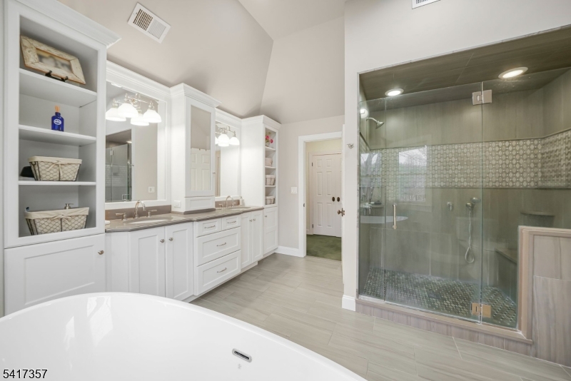 47 Abbott Road Montville, NJ 07082 - Photo 19 of 32 a large white bathroom with a granite countertop tub sink and shower