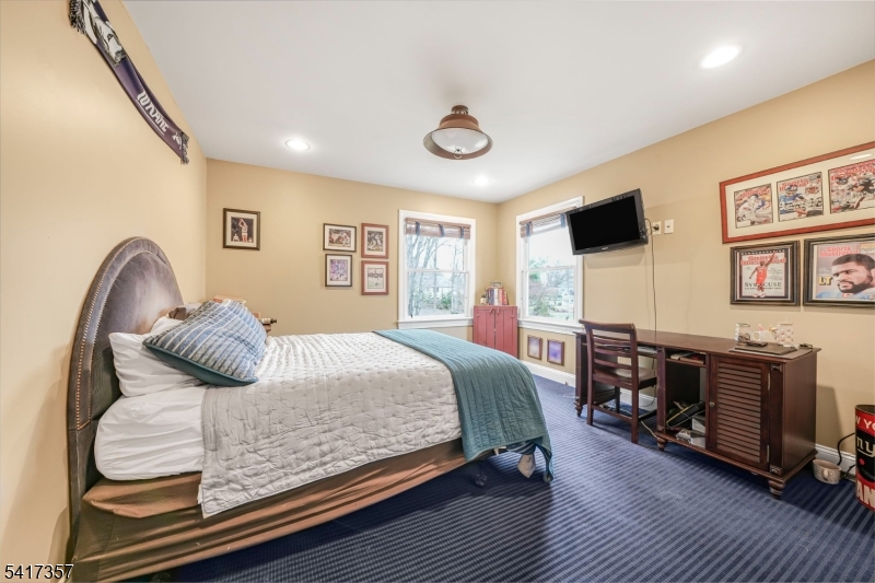 47 Abbott Road Montville, NJ 07082 - Photo 20 of 32 a bedroom with a bed and wooden floor