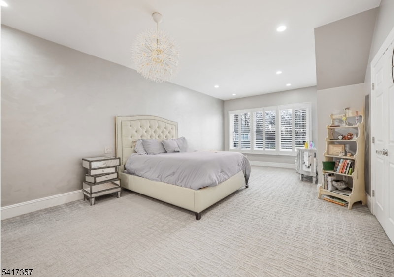 47 Abbott Road Montville, NJ 07082 - Photo 23 of 32 a spacious bedroom with a bed and a window