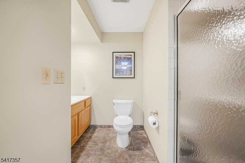 47 Abbott Road Montville, NJ 07082 - Photo 28 of 32 a bathroom with a toilet and a shower