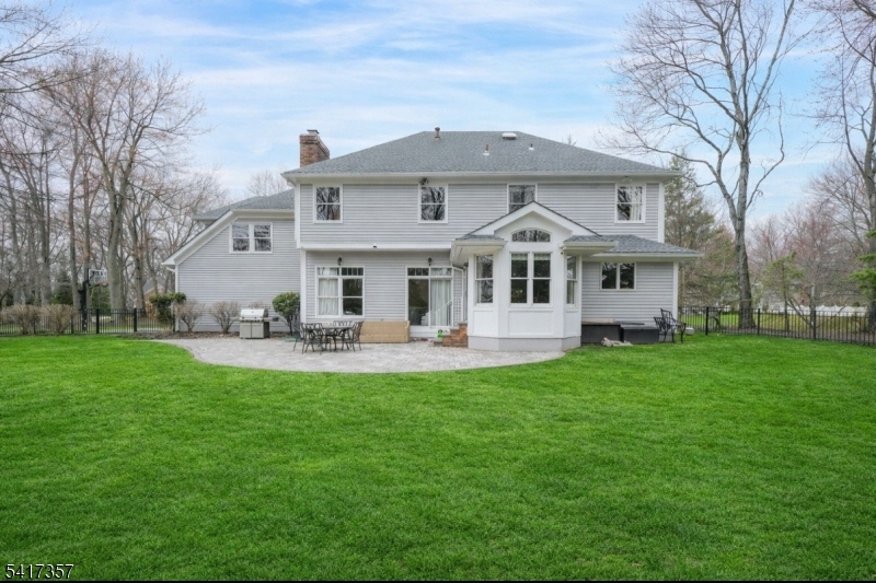 47 Abbott Road Montville, NJ 07082 - Photo 29 of 32 a front view of a house with a yard table and chairs