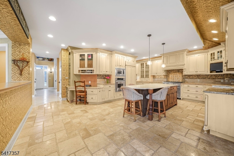 47 Abbott Road Montville, NJ 07082 - Photo 7 of 32 a kitchen with stainless steel appliances kitchen island granite top and refrigerator