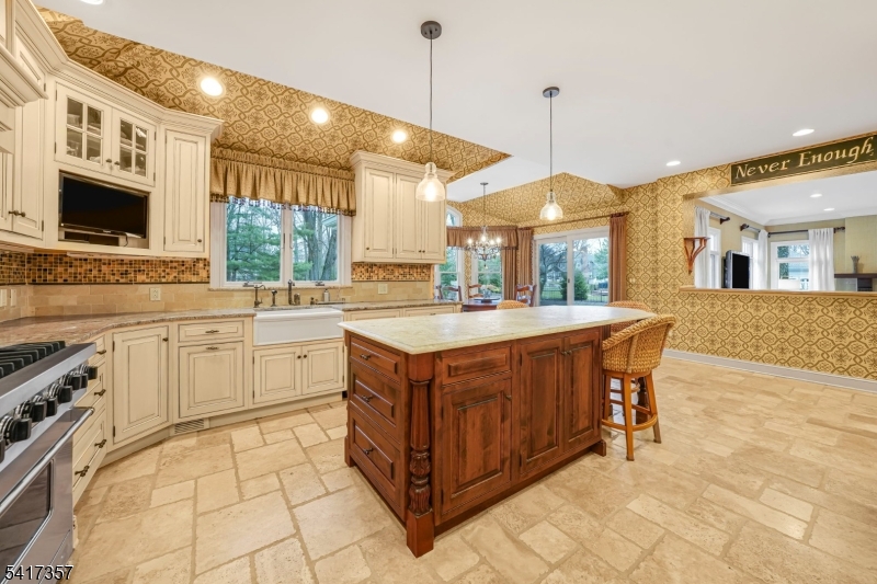 47 Abbott Road Montville, NJ 07082 - Photo 9 of 32 a kitchen with stainless steel appliances granite countertop a stove a sink and a refrigerator