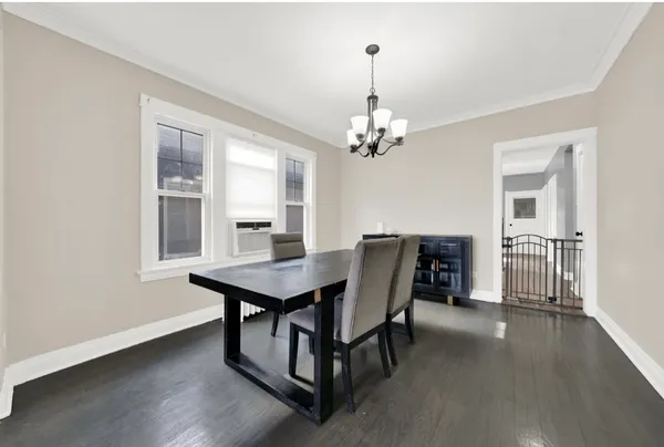 a view of a dining room with furniture and window