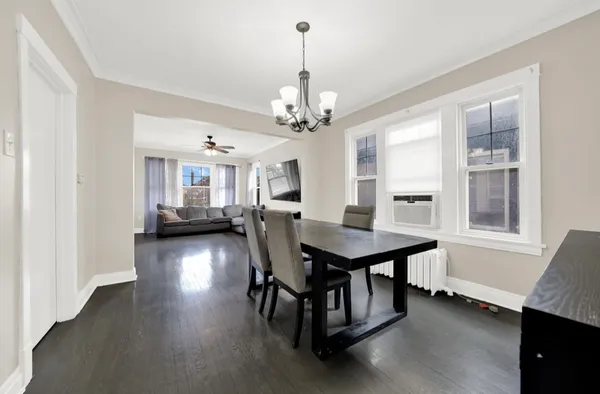 a view of a dining room with furniture and window