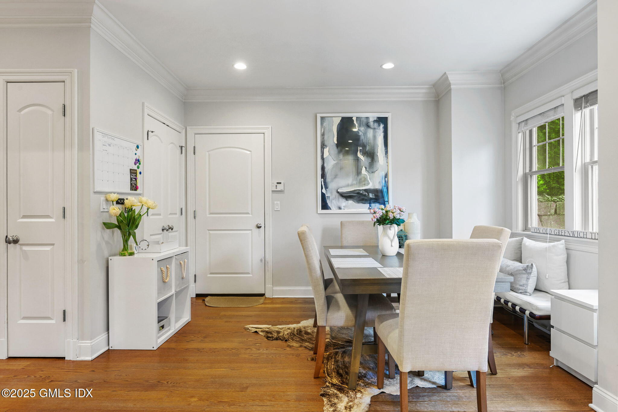 25 Le Grande Avenue, Unit B Greenwich, CT 06830 - Photo 12 of 37 a view of a dining room with furniture window and wooden floor
