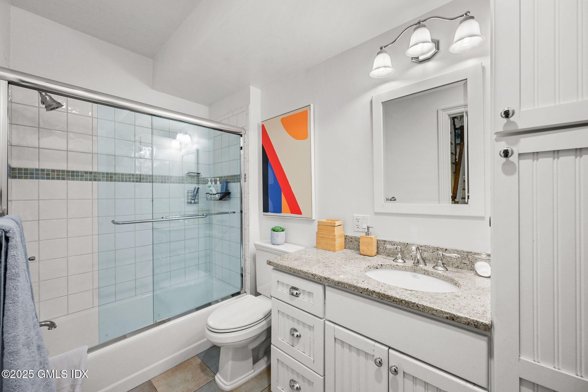 25 Le Grande Avenue, Unit B Greenwich, CT 06830 - Photo 16 of 37 a bathroom with a sink vanity mirror and toilet