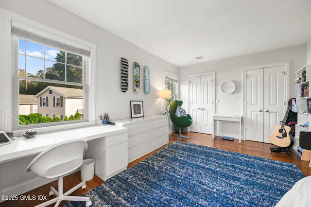 a spacious bedroom with a bed and a couch