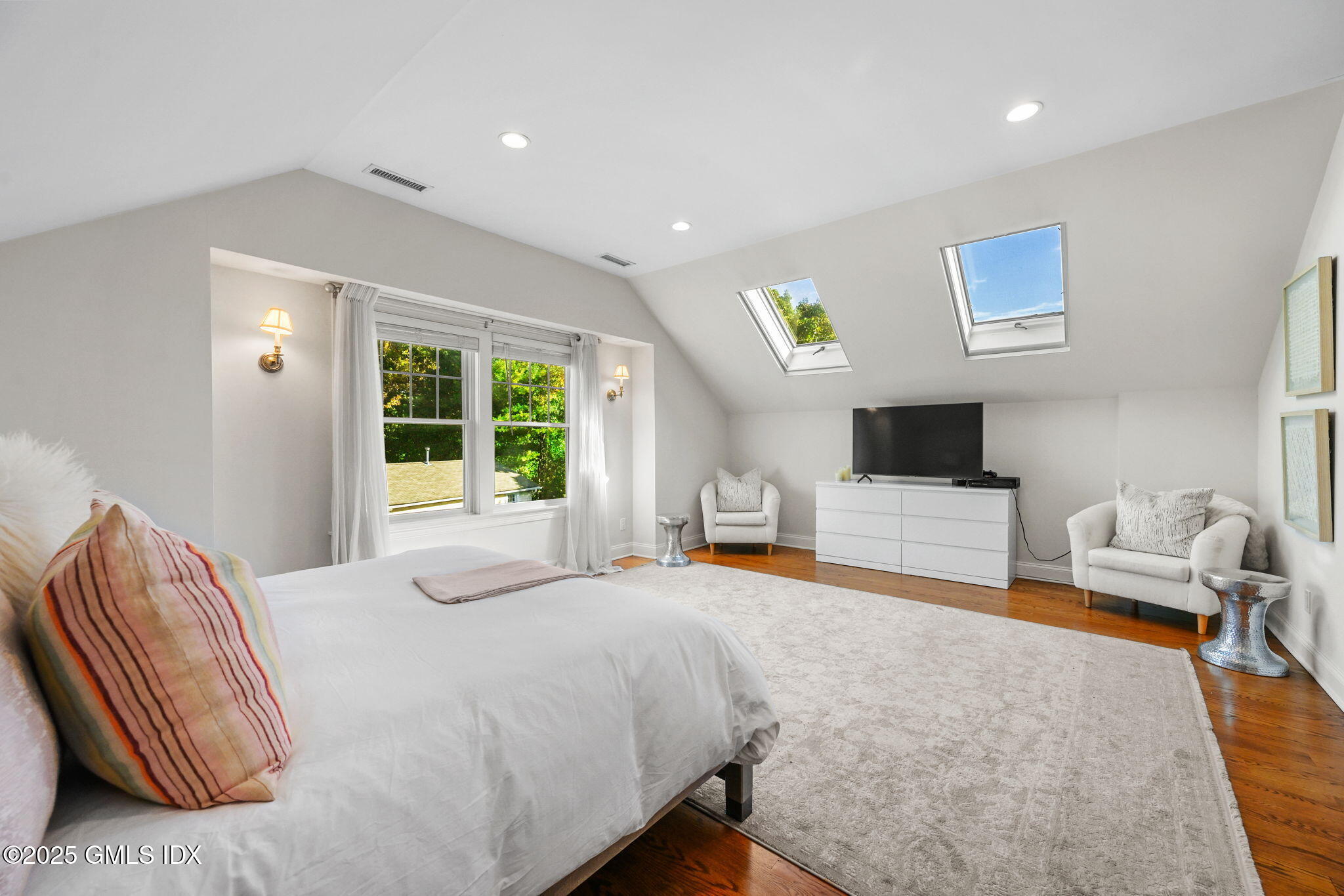 25 Le Grande Avenue, Unit B Greenwich, CT 06830 - Photo 23 of 37 a bedroom with a bed and a flat screen tv