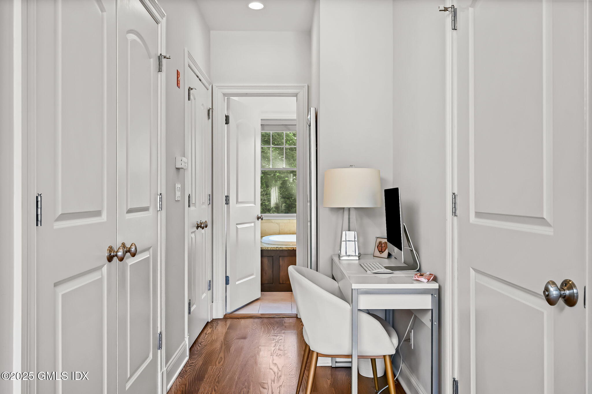 25 Le Grande Avenue, Unit B Greenwich, CT 06830 - Photo 24 of 37 a view of a bathroom with a sink mirror and window
