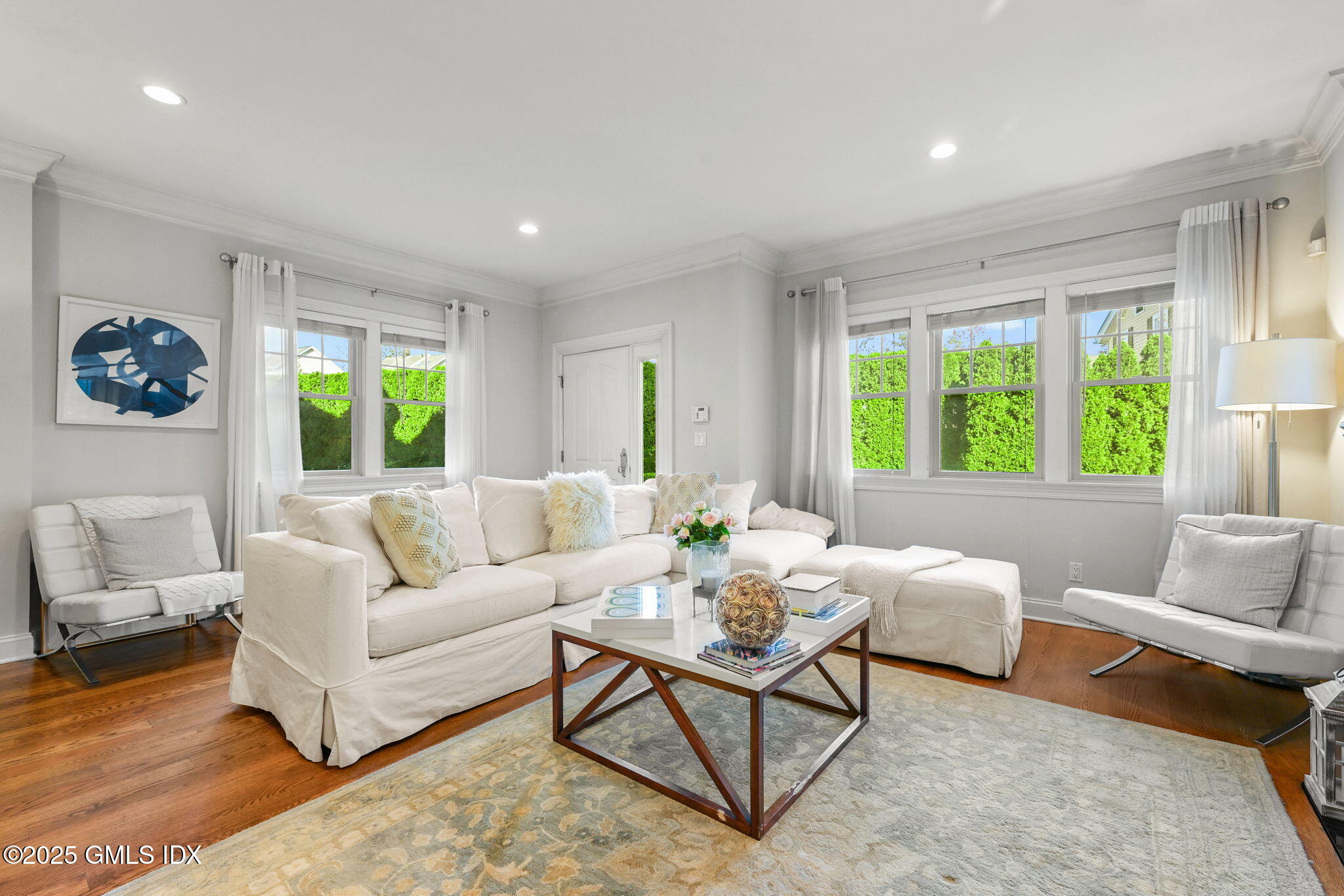 25 Le Grande Avenue, Unit B Greenwich, CT 06830 - Photo 5 of 37 a living room with furniture and a large window