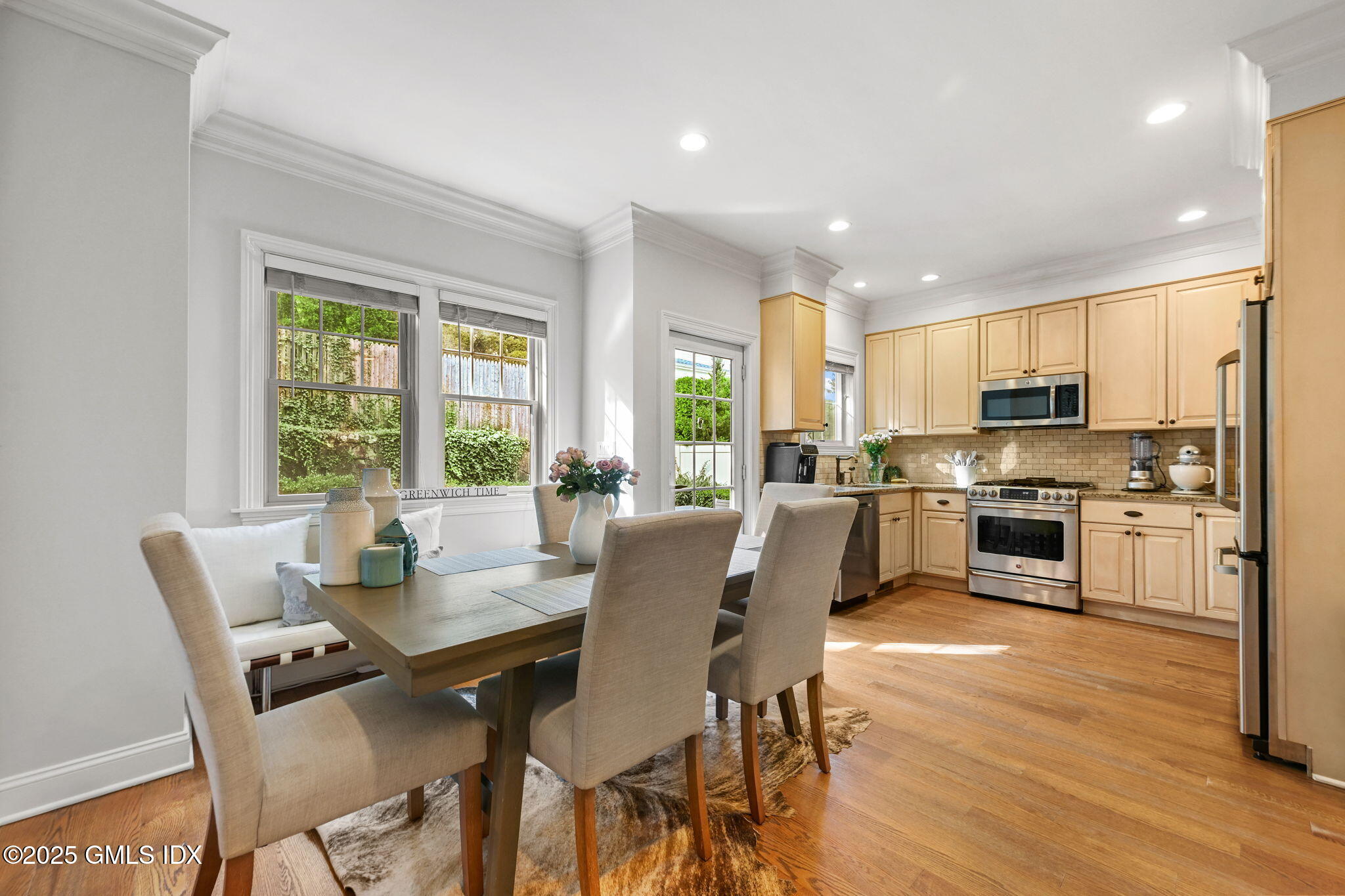 25 Le Grande Avenue, Unit B Greenwich, CT 06830 - Photo 9 of 37 a view of a dining room with furniture window and wooden floor