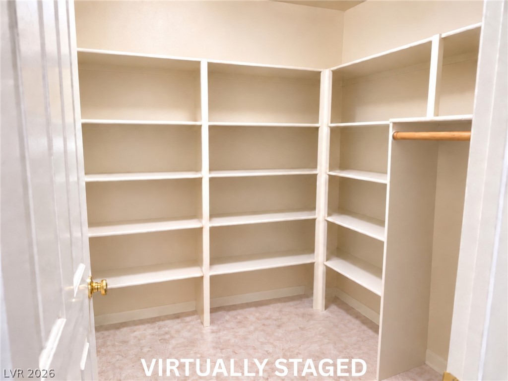 5470 Grain Mill Road Pahrump, NV 89061 - Photo 40 of 80 VIRTUALLY STAGED 7x7 storage room with built-in shelves. Floor-to-ceiling built-in shelving maximizes storage space in this organized walk-in closet.