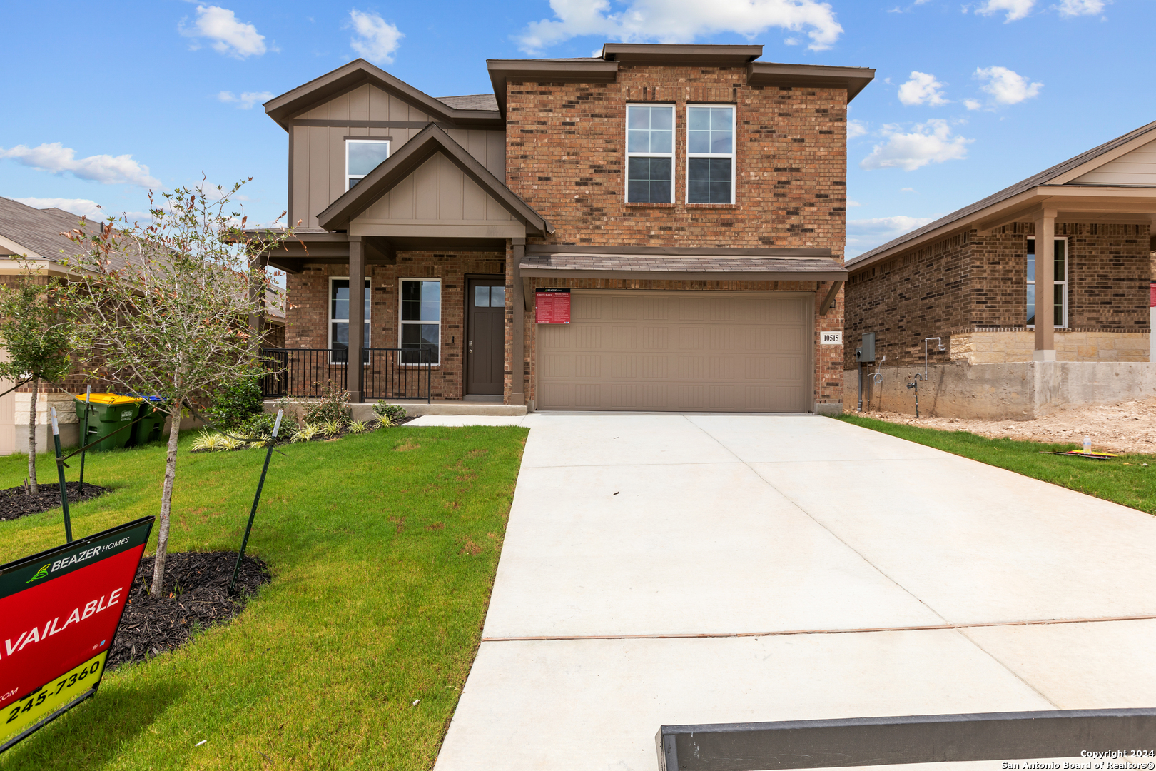 10515 Briceway Bay Helotes, TX 78254 - Photo 1 of 15 a front view of a house with a yard and potted plants
