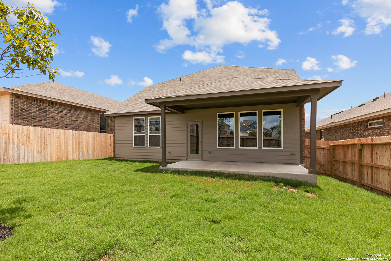 10515 Briceway Bay Helotes, TX 78254 - Photo 15 of 15 a view of a house with a yard and a large tree