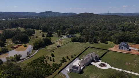 an aerial view of a house with mountain view