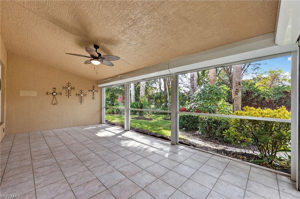 8534 Chase Preserve Drive Naples, FL 34113 - Photo 20 of 44 Unfurnished sunroom with a ceiling fan