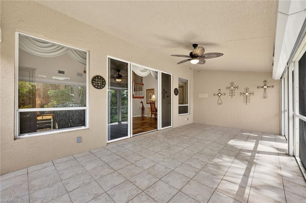 8534 Chase Preserve Drive Naples, FL 34113 - Photo 21 of 44 Unfurnished sunroom with a ceiling fan