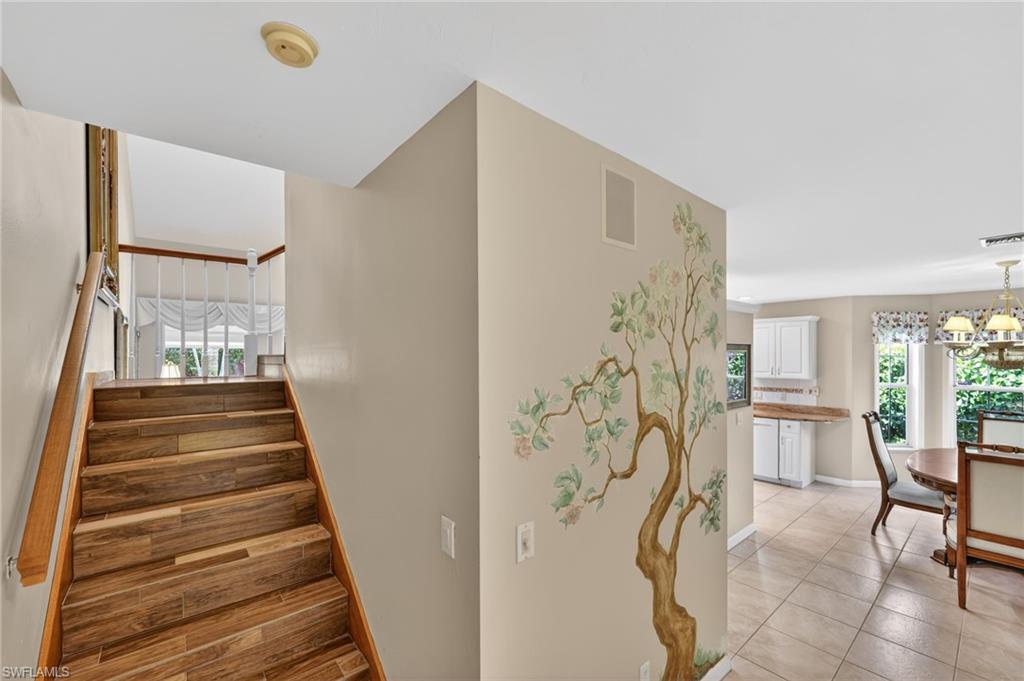 8534 Chase Preserve Drive Naples, FL 34113 - Photo 25 of 44 Staircase with healthy amount of natural light
