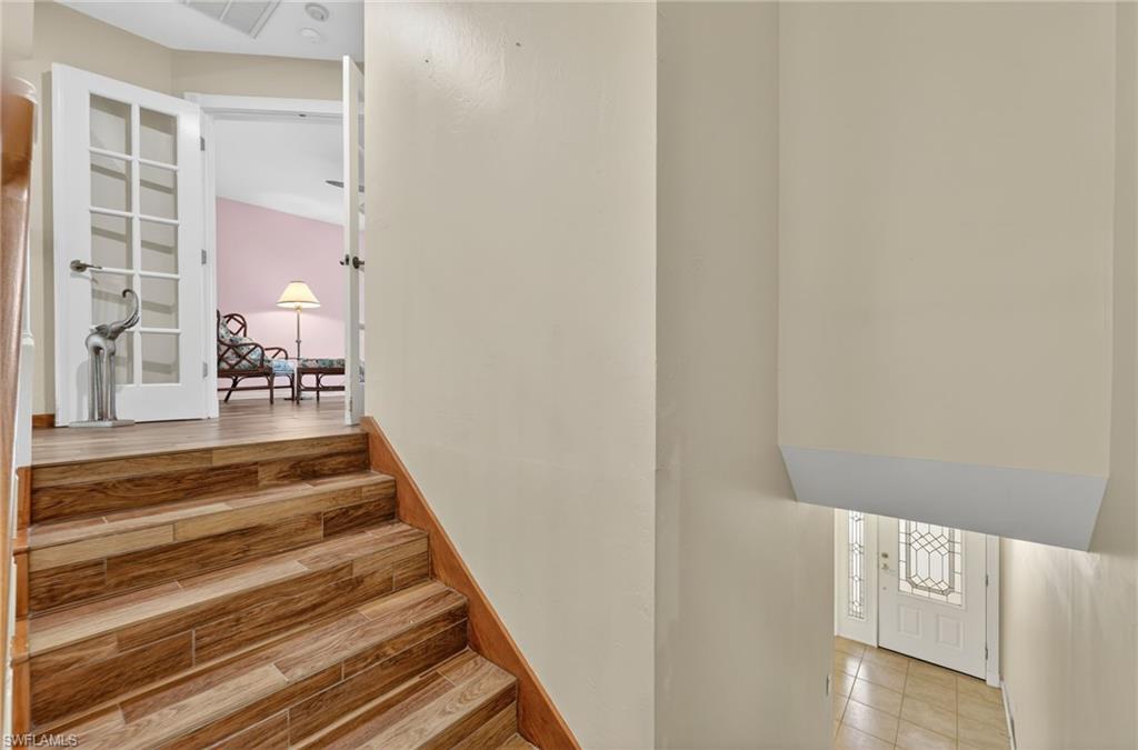 8534 Chase Preserve Drive Naples, FL 34113 - Photo 26 of 44 View of stairway to Primary Bedroom 2nd Fl